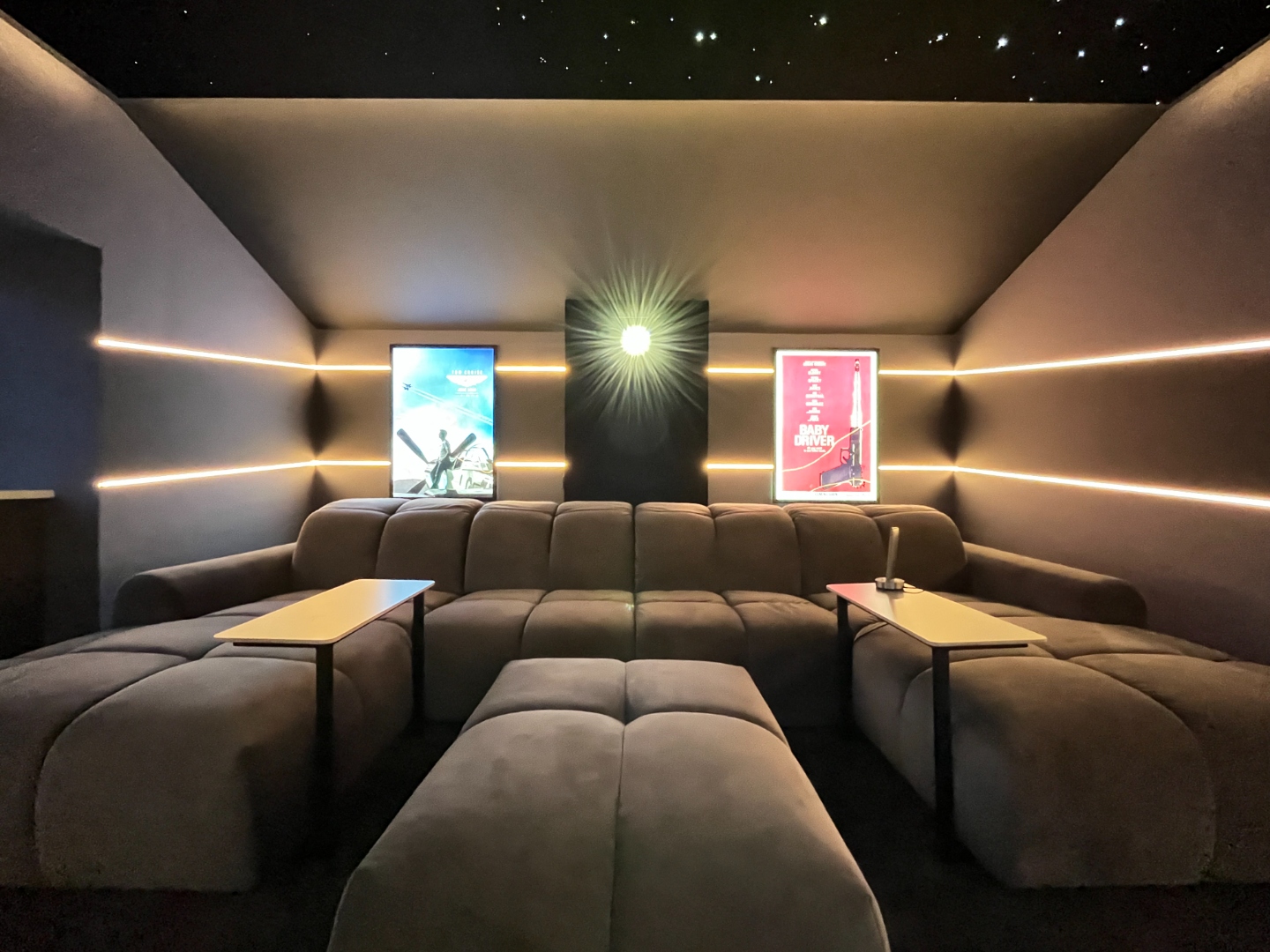Front view of private cinema with star ceiling and film posters