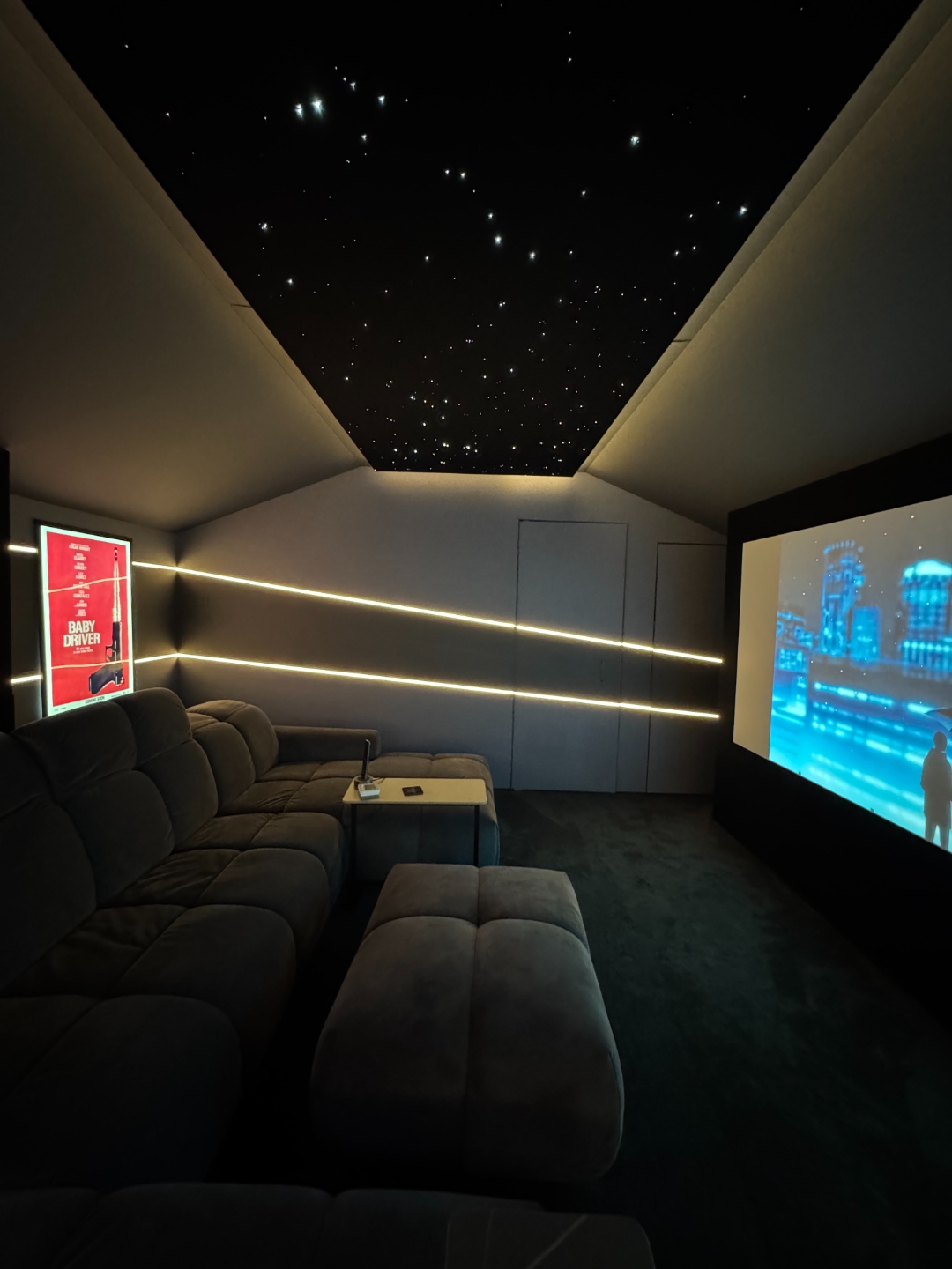 Private cinema room with star ceiling and luxury seating